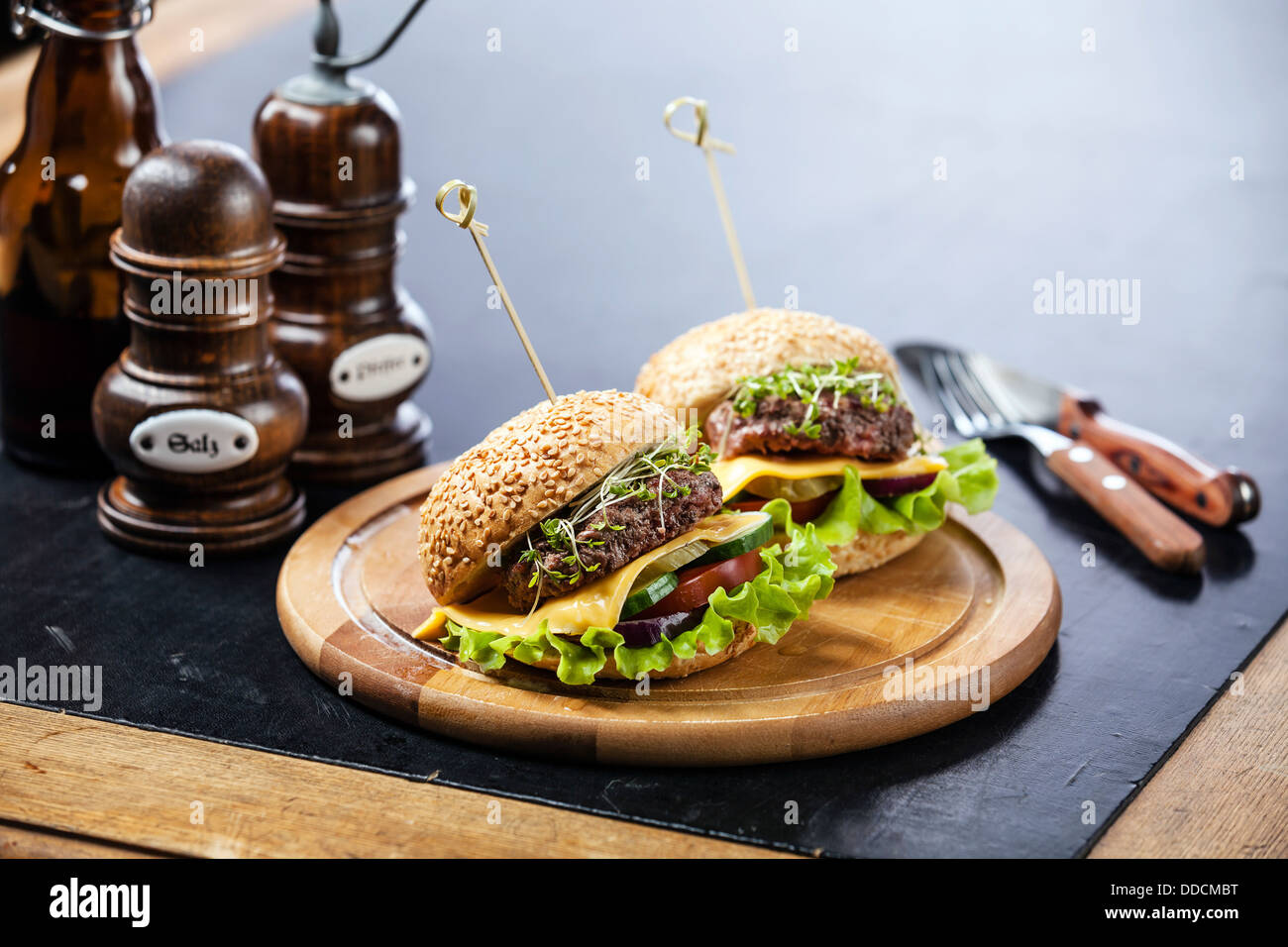Two burgers with meat and greens Stock Photo