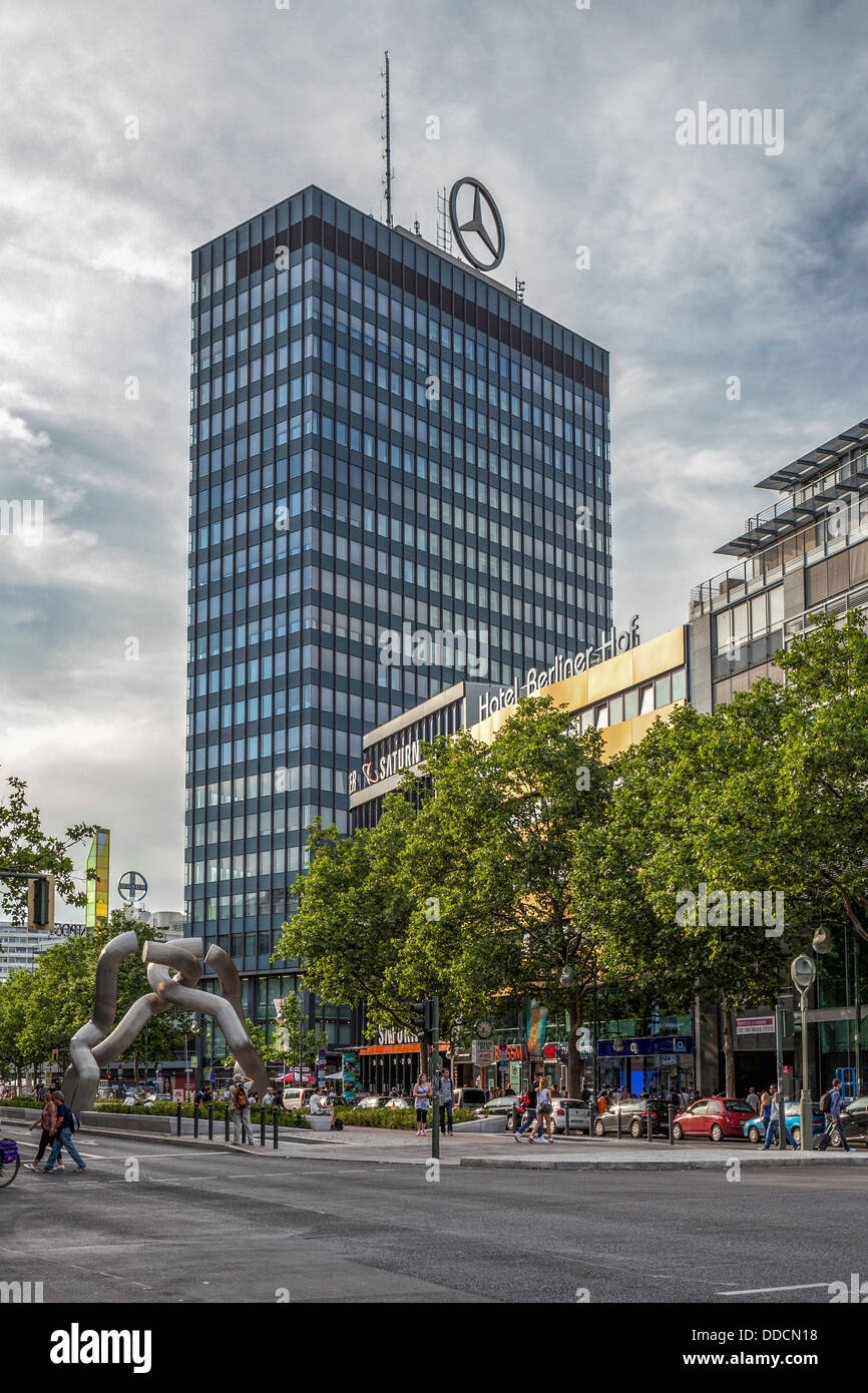 Mercedes Benz logo on building and broken chain sculpture in Tauentzienstrasse extension of Kurfürstendamm, Berlin Stock Photo