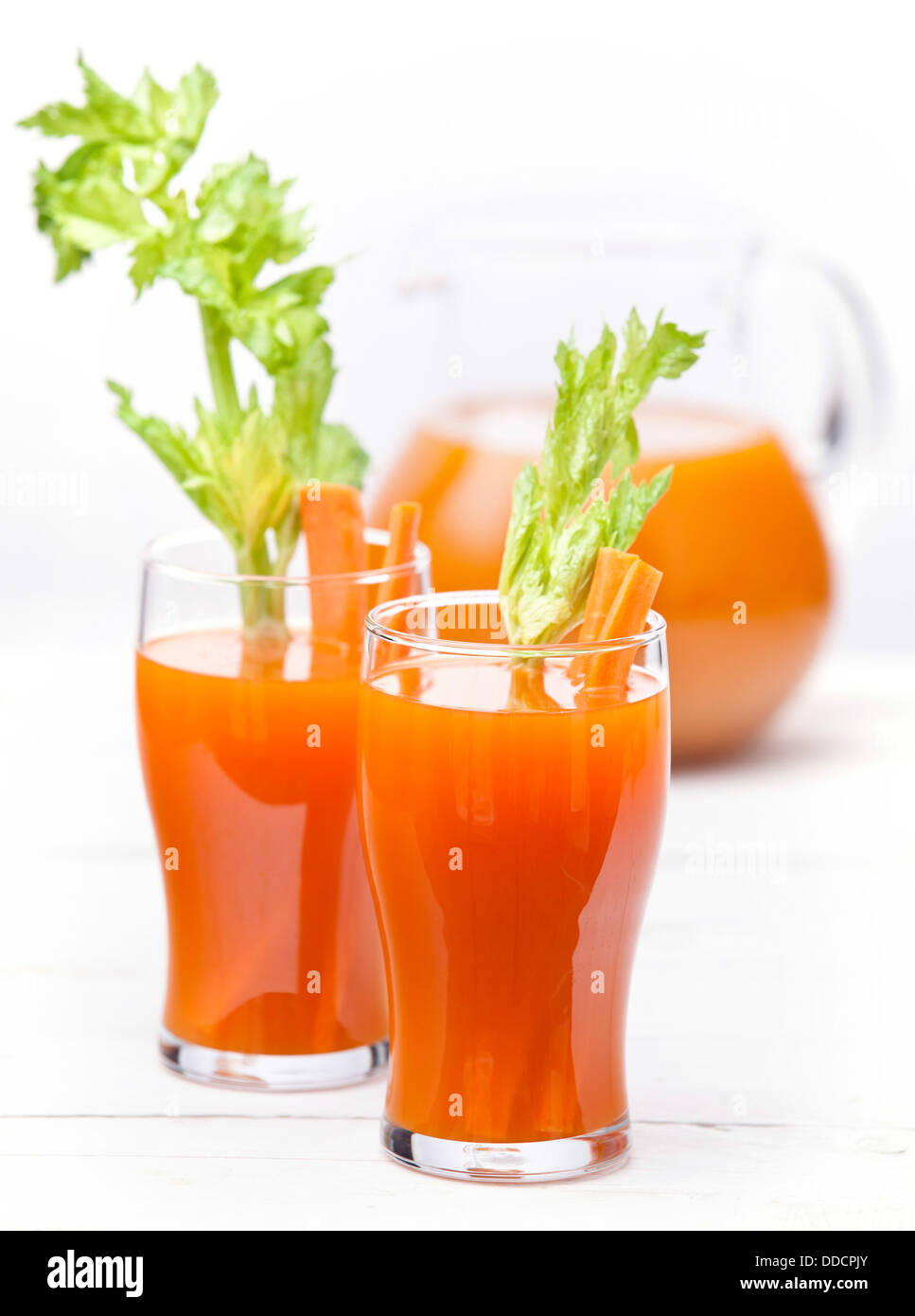 Fresh carrot and pumpkin juice on white background Stock Photo