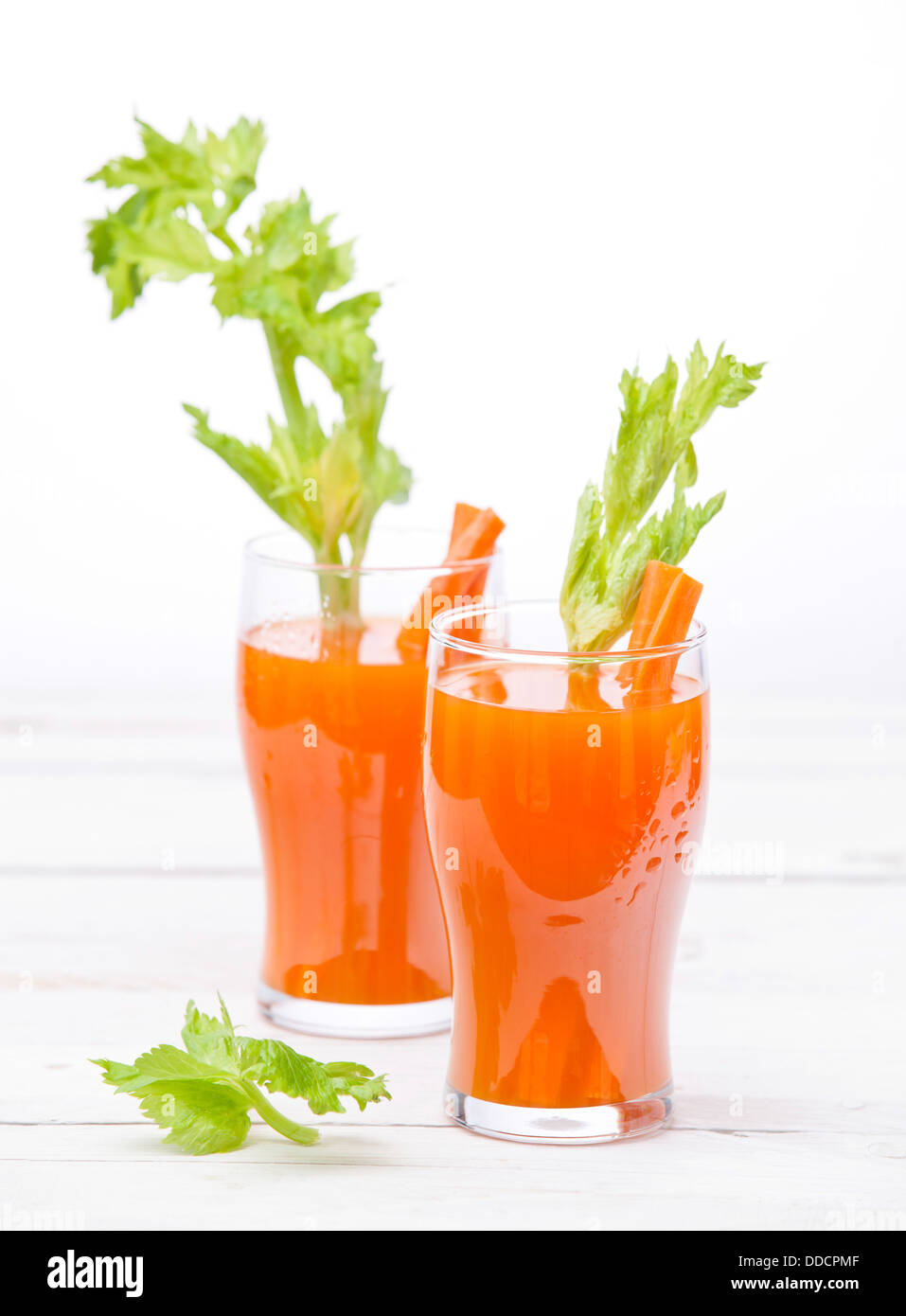 Fresh carrot and pumpkin juice on white background Stock Photo