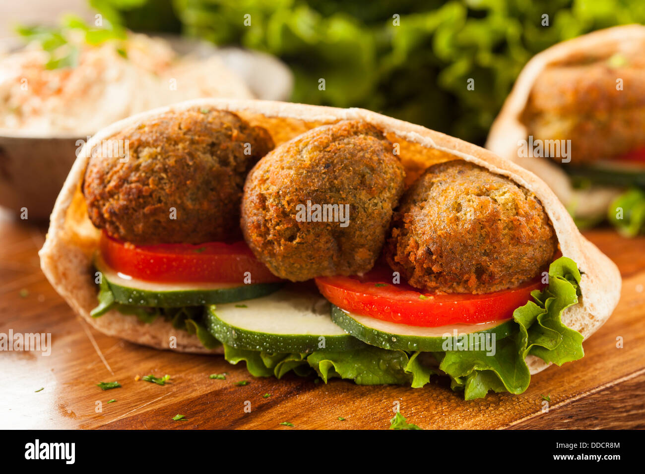 Organic Falafel in a Pita Pocket with Tomato and Cucumber Stock Photo