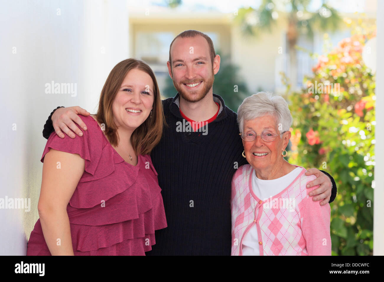 Portrait of a senior woman standing with her son and daughter-in-law Stock Photo