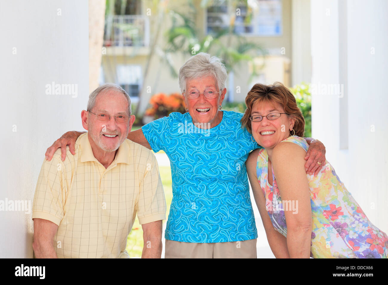 Senior mother standing with her children Stock Photo