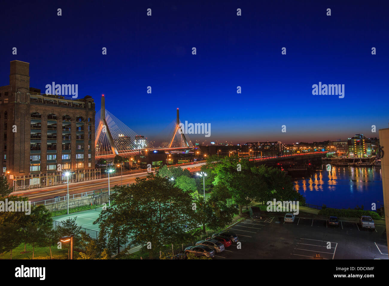 City lit up at dusk, Leonard P. Zakim Bunker Hill Bridge, North End, Boston, Massachusetts, USA Stock Photo