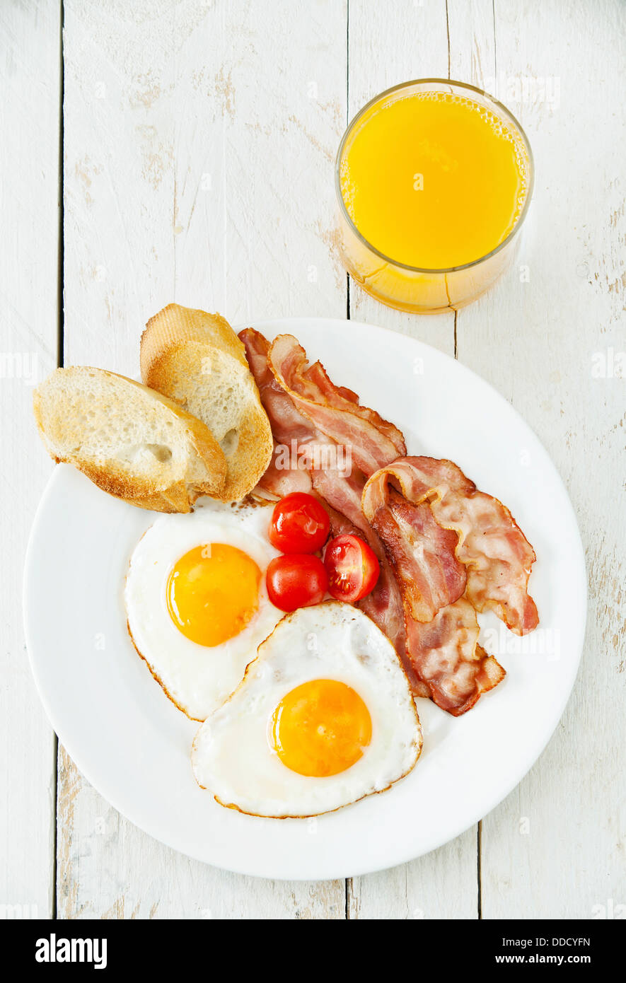 Traditional breakfast eggs with bacon Stock Photo