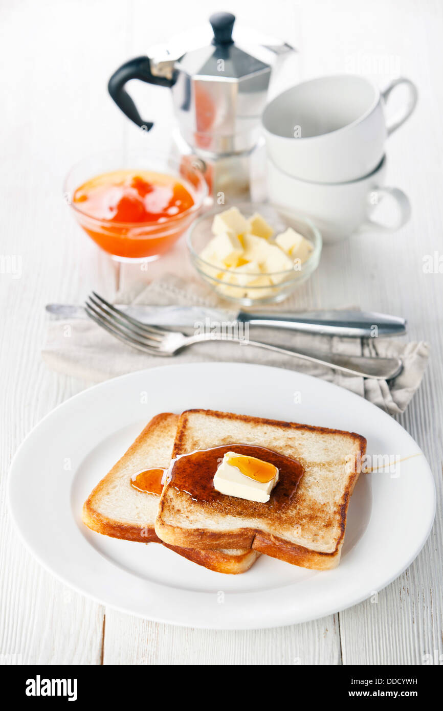 Golden brown french toast with syrup and butter Stock Photo