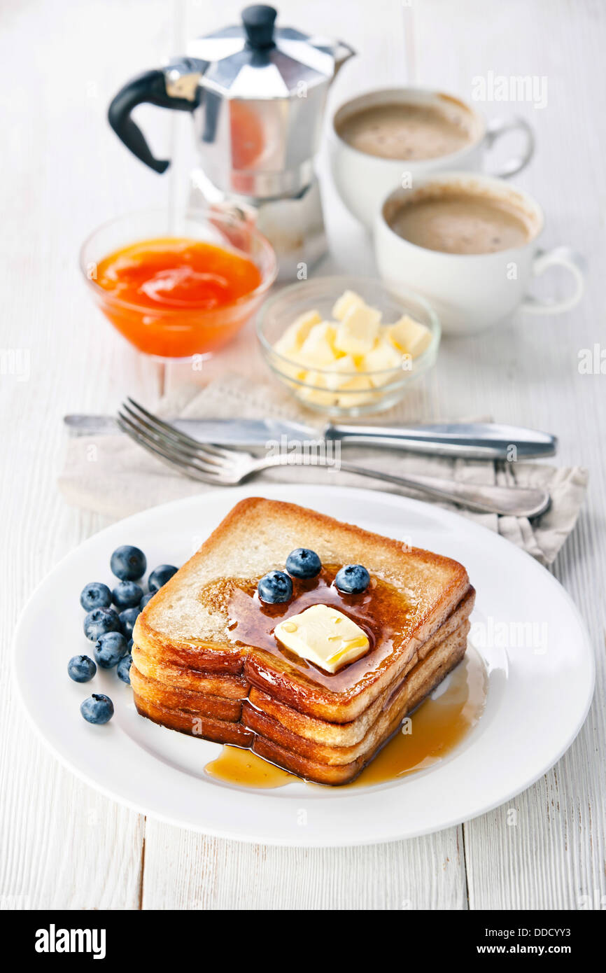 French toast with blueberries, maple syrup and butter Stock Photo