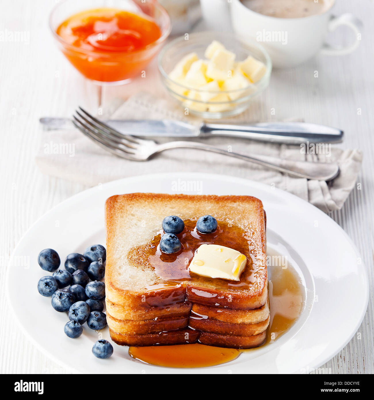 French toast with blueberries, maple syrup and butter Stock Photo