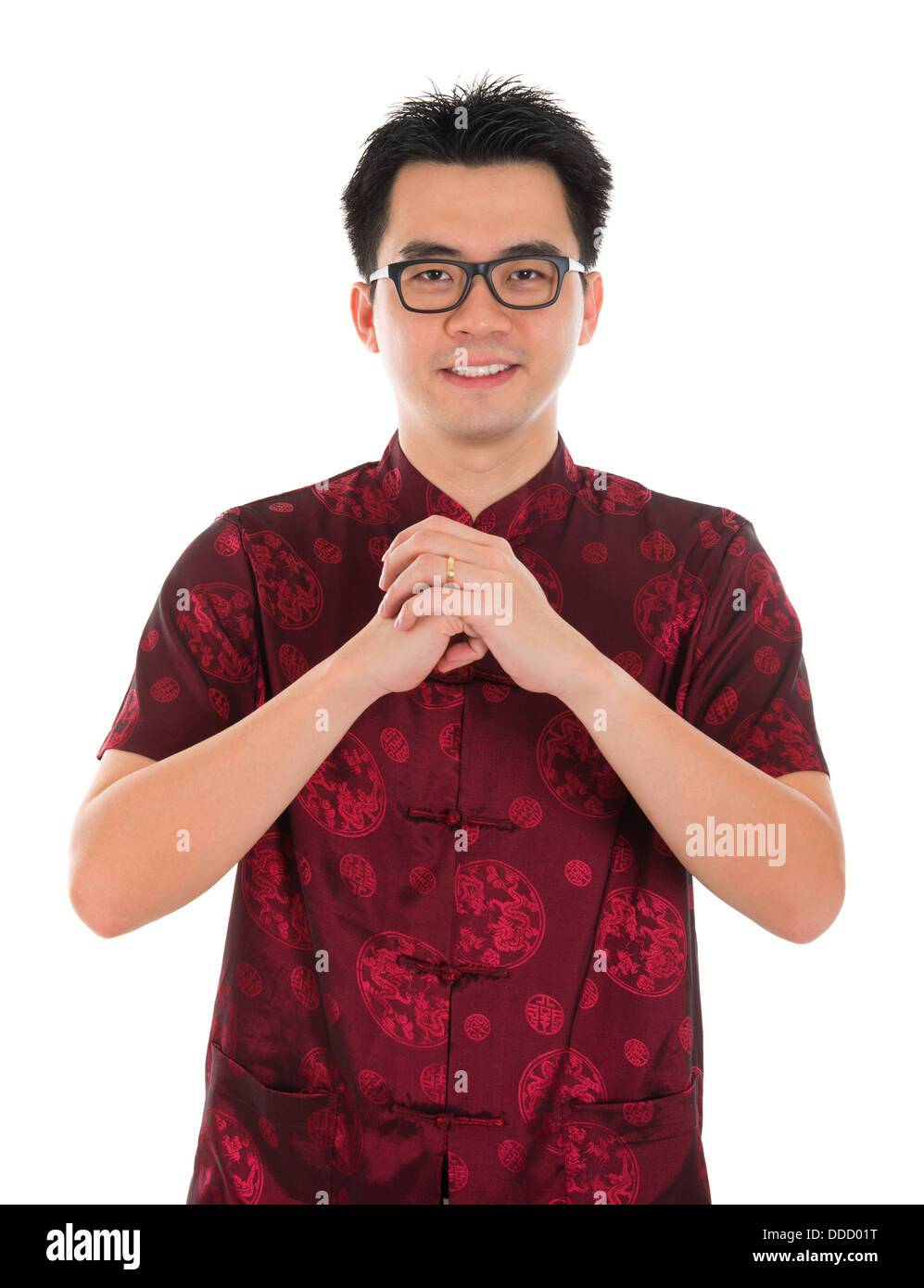 Asian man with Chinese traditional dress cheongsam or tang suit greeting. Chinese new year concept, male model isolated on white background. Stock Photo