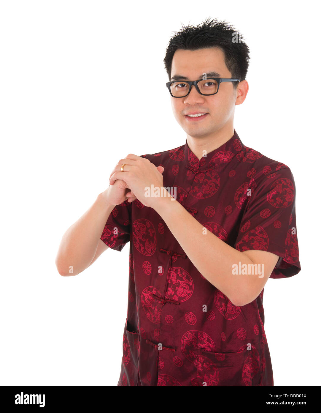 Asian male with Chinese traditional dress cheongsam or tang suit greeting.  Chinese new year concept, male model isolated on white background Stock  Photo - Alamy