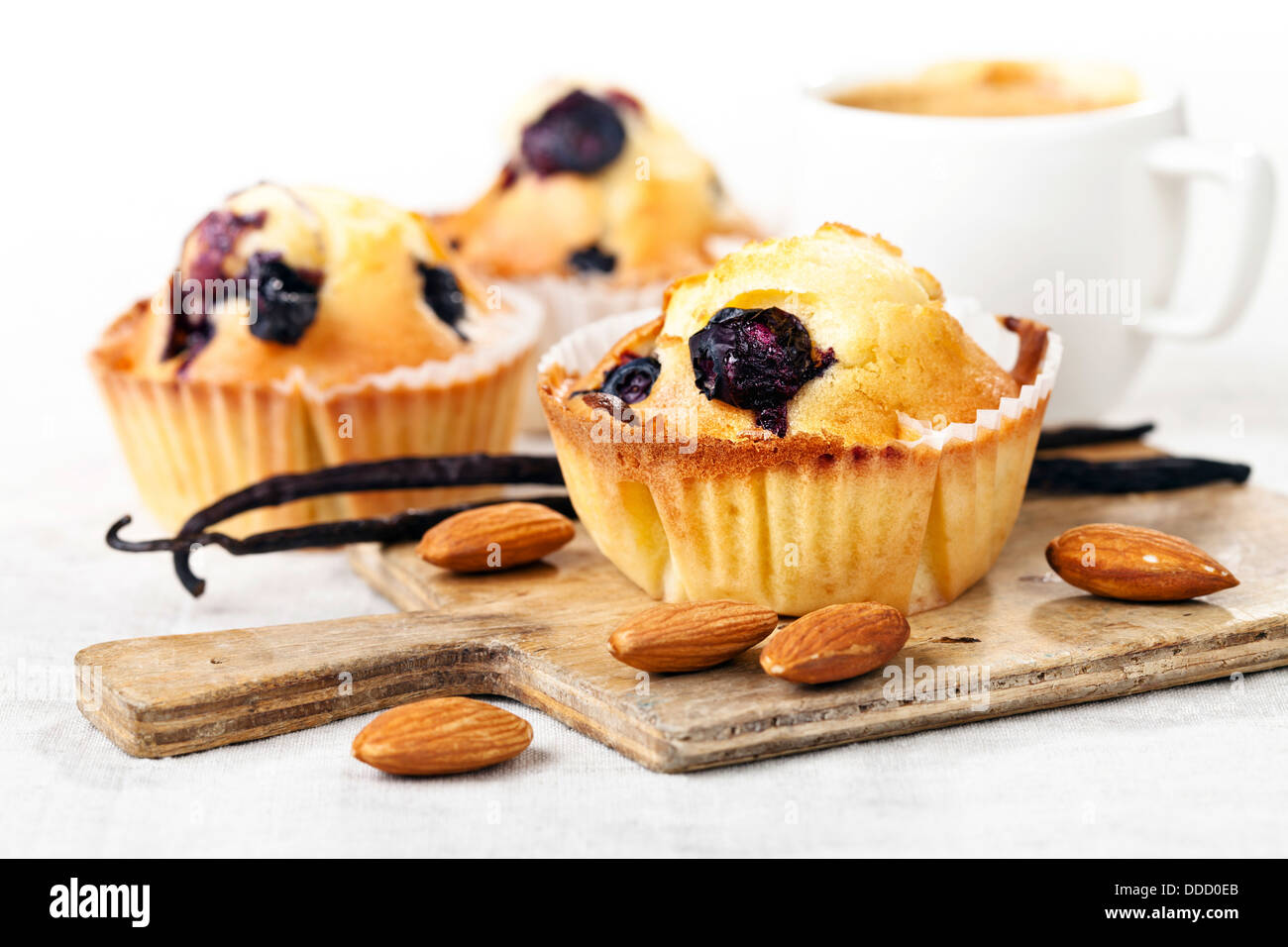 Three Homemade Blueberry Muffin cupcakes on white background Stock Photo