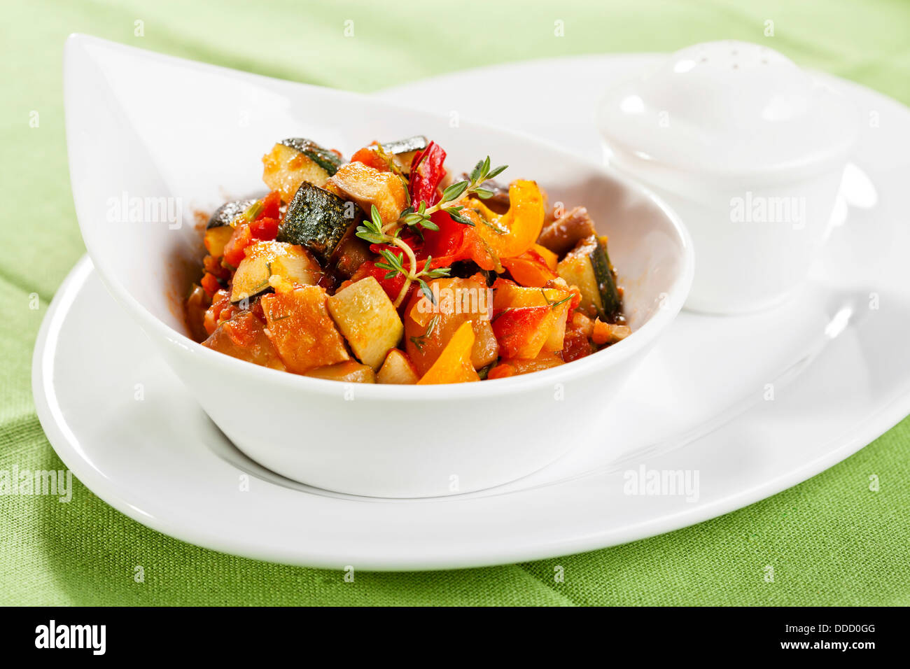 Traditional vegetable ratatouille on green background Stock Photo