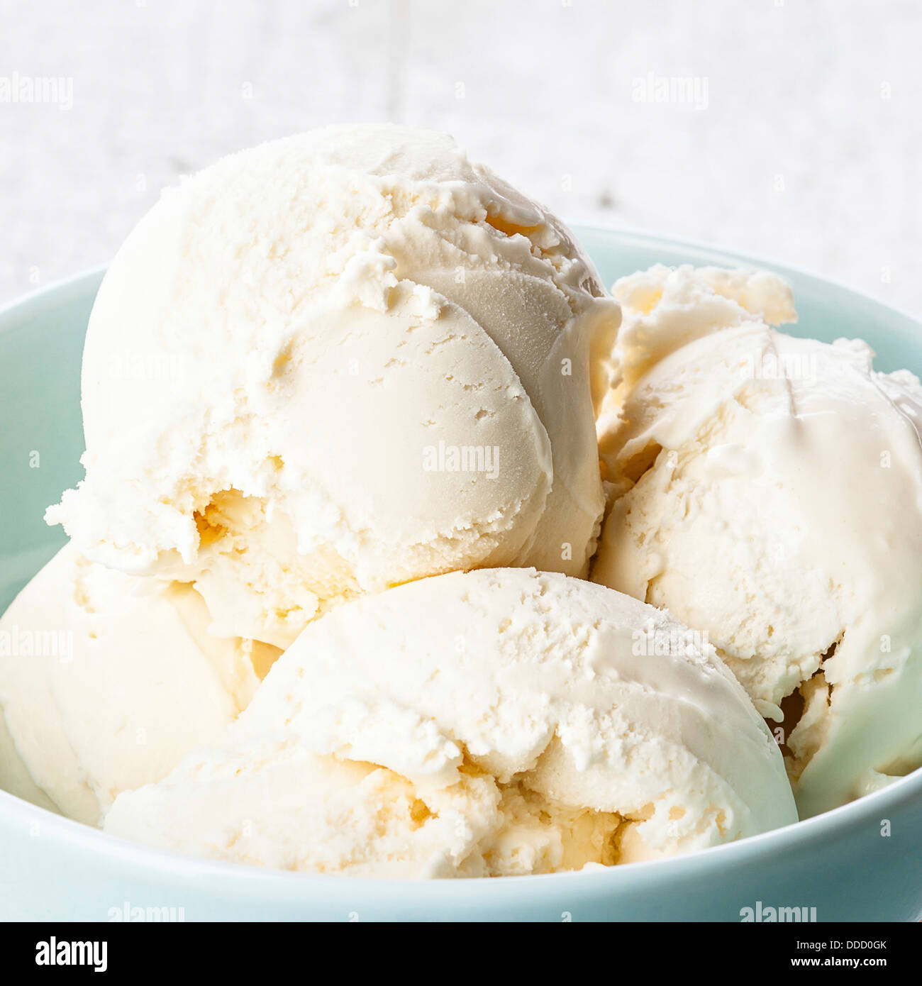 Vanilla ice cream in blue bowl Stock Photo - Alamy