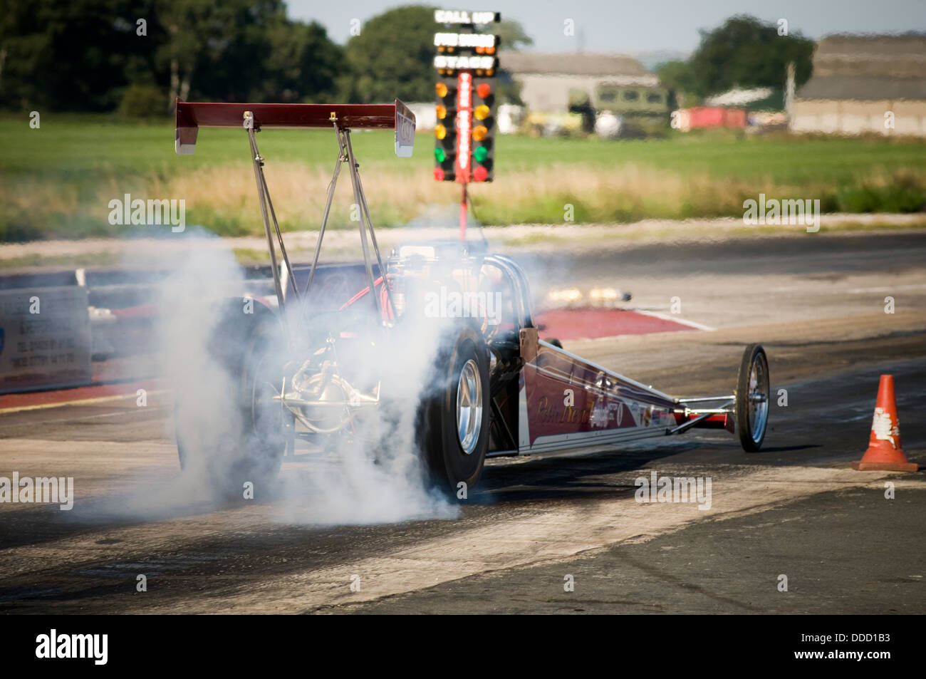 dragster heating its tires before a race Stock Photo