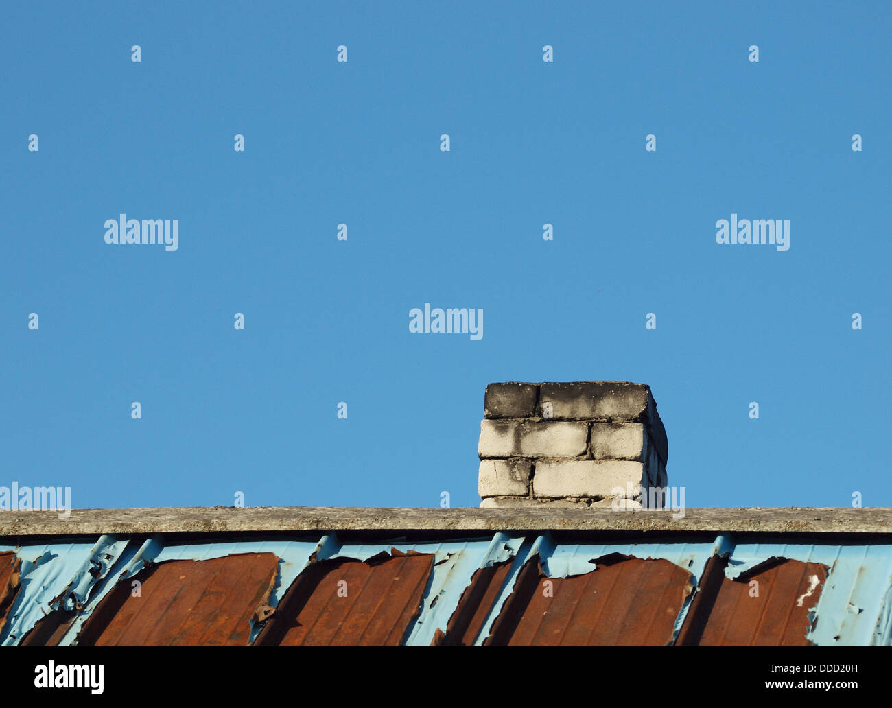 Brick chimney and roof on a background of the blue sky Stock Photo - Alamy