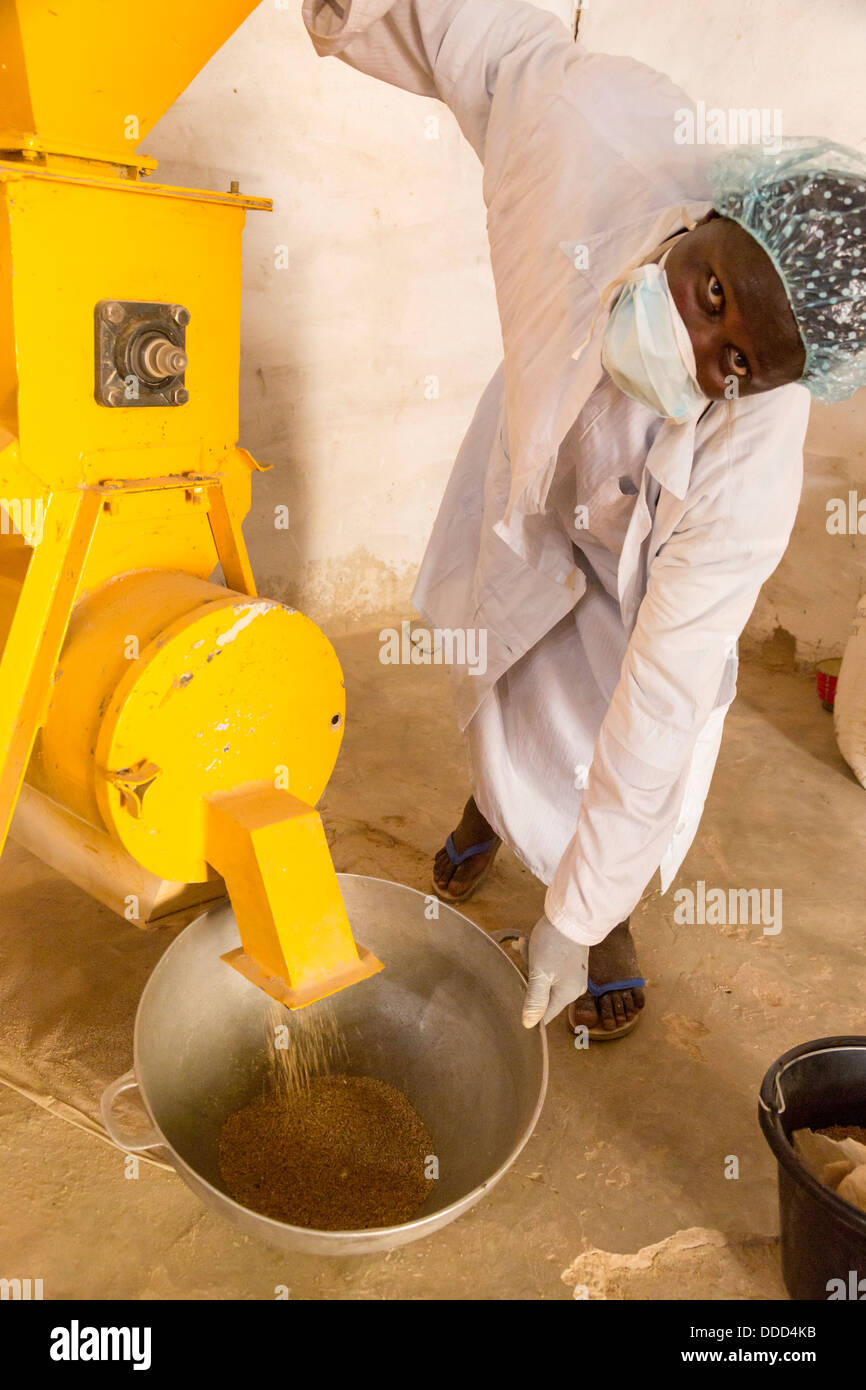 Collecting Maize Flour at Kaymor Village Maize Grinding Facility, Senegal. An Africare Project. Stock Photo