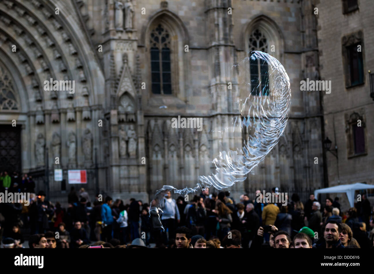 An exploding bubble during an exhibition in Barcelona Cathedral square. Spain. Stock Photo
