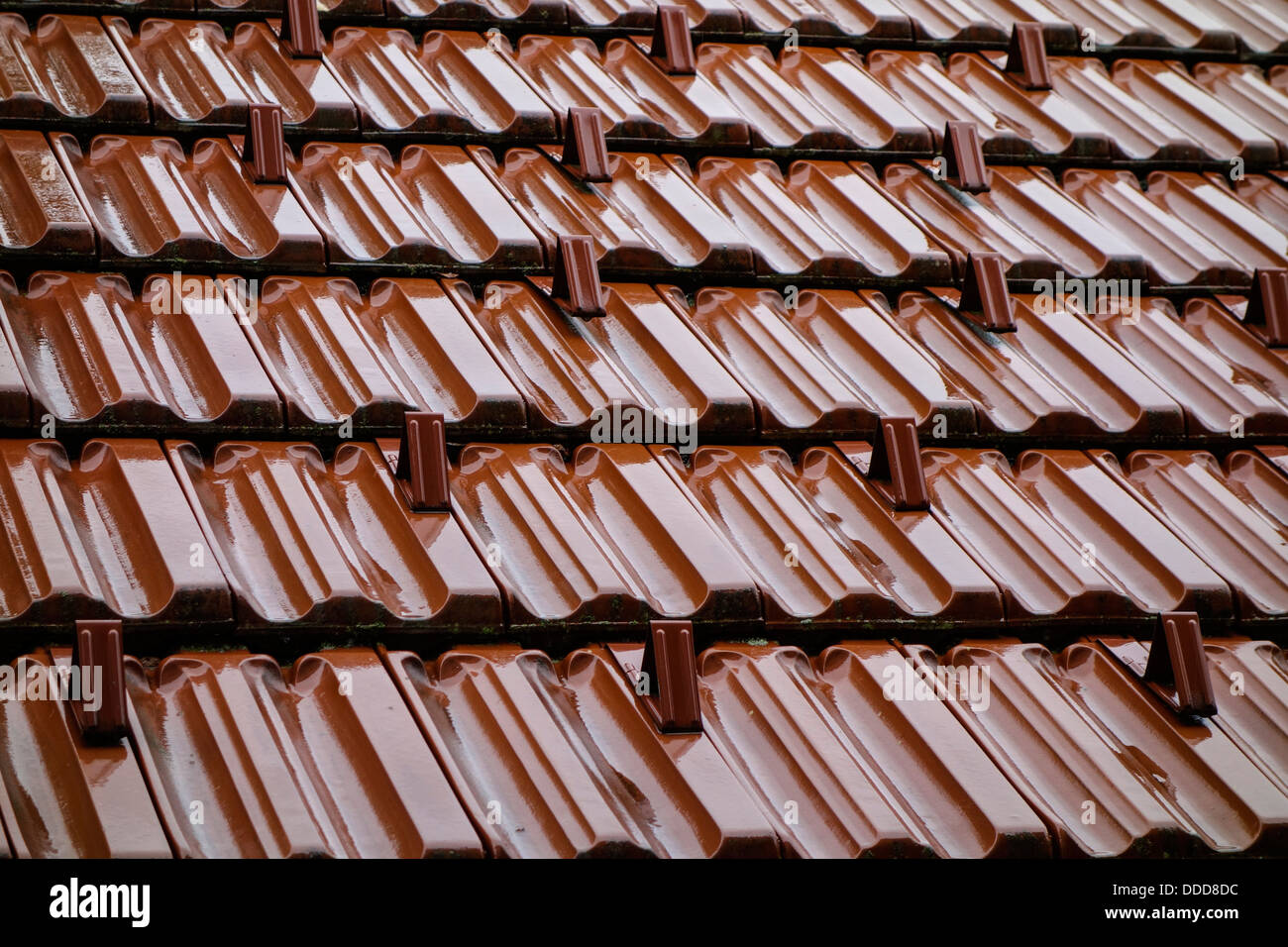 Wet tiled roof in the rain Stock Photo