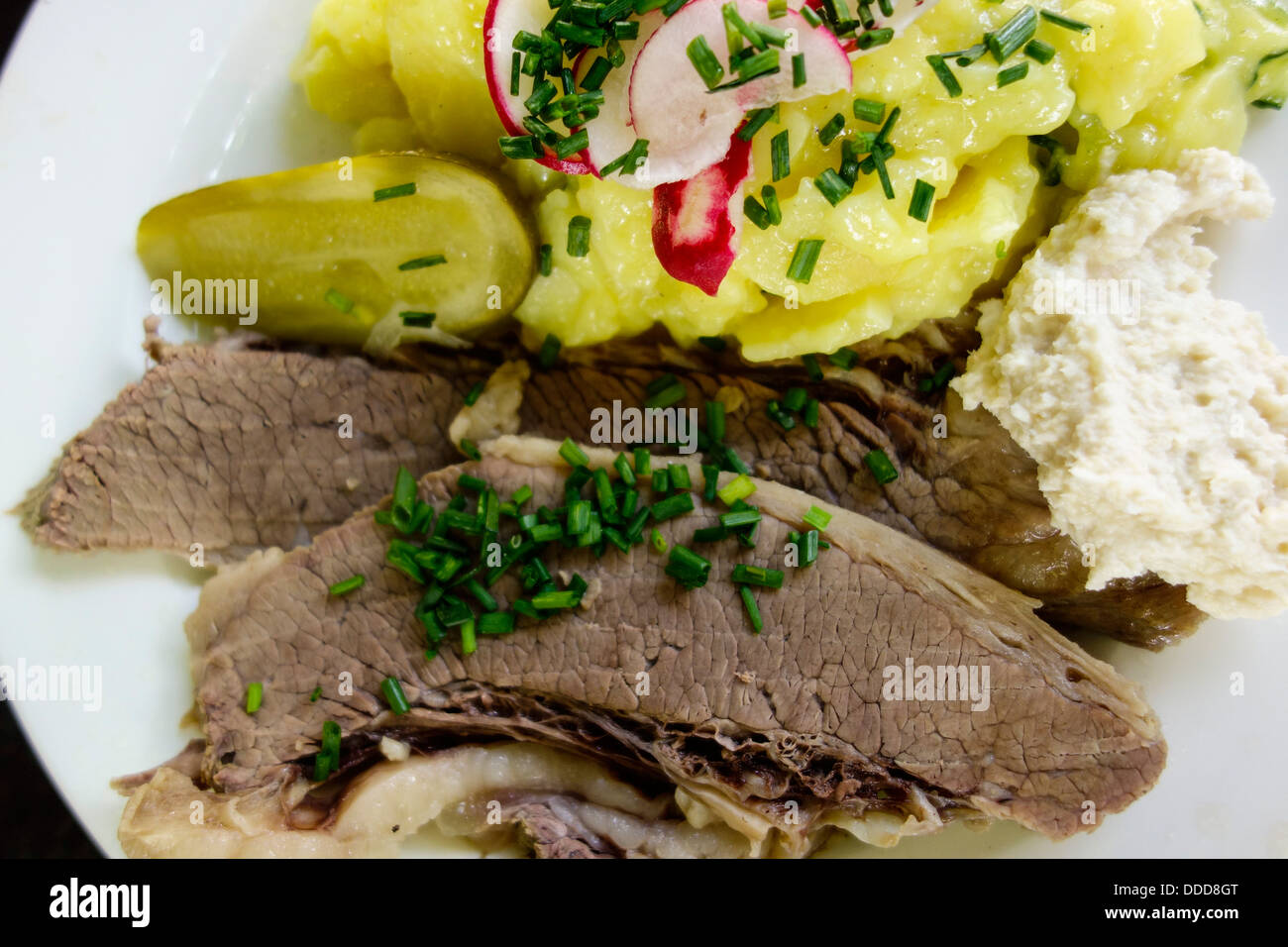 Boiled beef with horseradish and potato salad Stock Photo