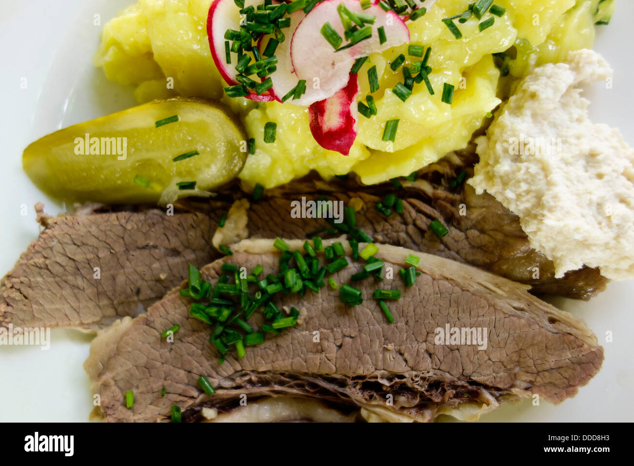 Boiled beef with horseradish and potato salad Stock Photo