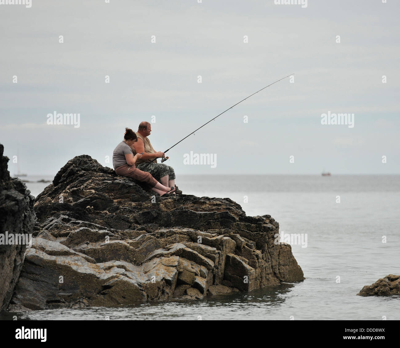 Sea rocks fishing rod hi-res stock photography and images - Alamy