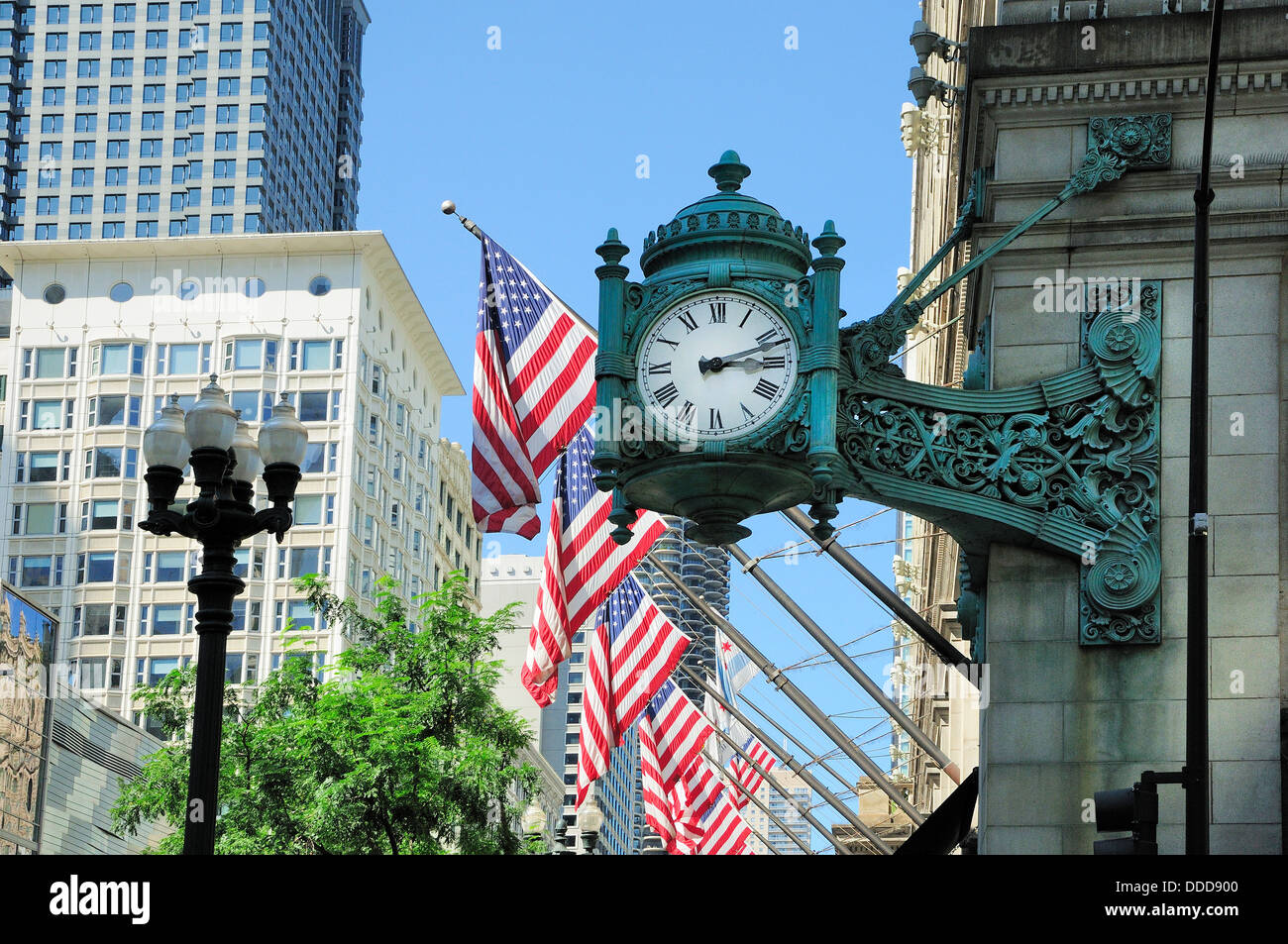 Antique clock on cornerstone of Macy's building in Chicago. Stock Photo
