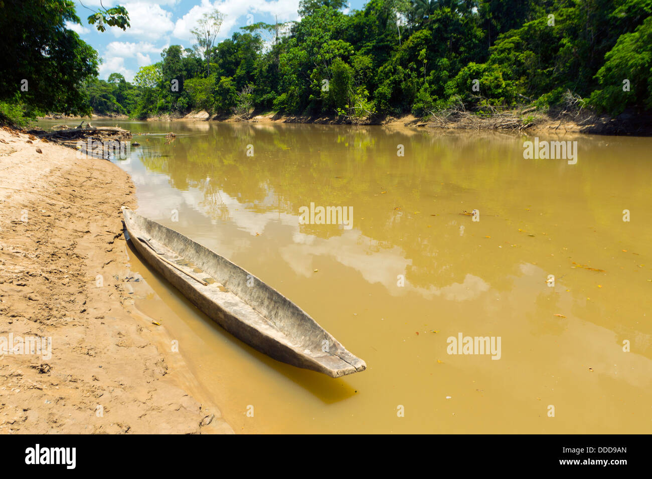 Dugout canoe beside the Rio Cononaco in the Ecuadorian Amazon Stock Photo