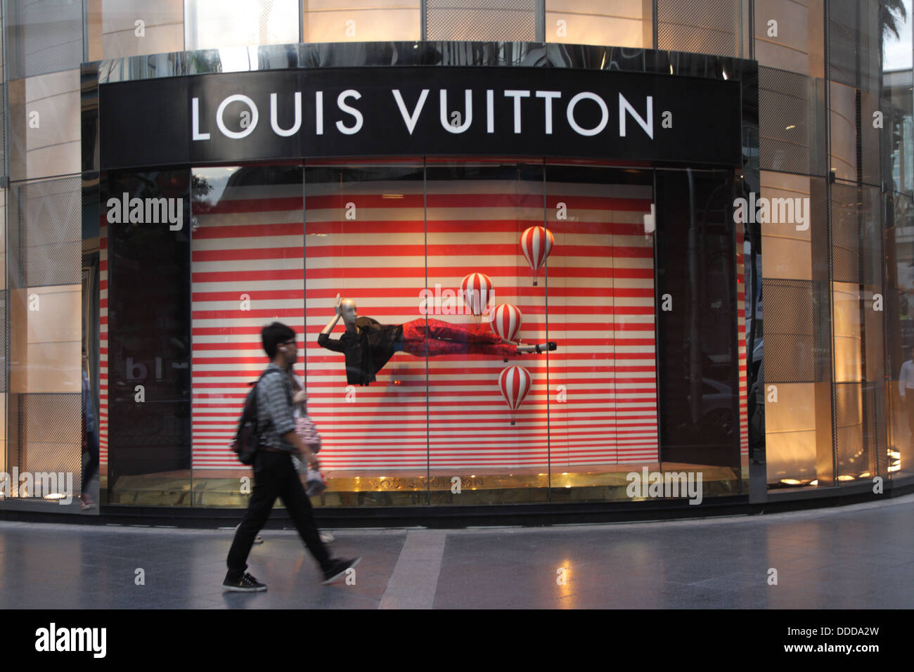 People walk passing through Louis Vuitton Shop at Gaysorn Plaza