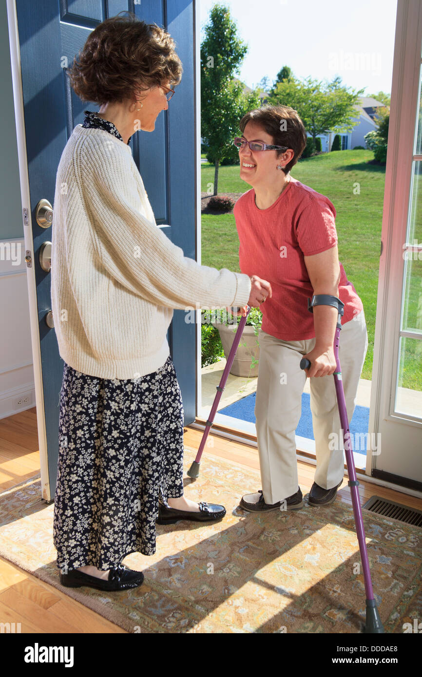 Greeting at the door hi-res stock photography and images - Alamy