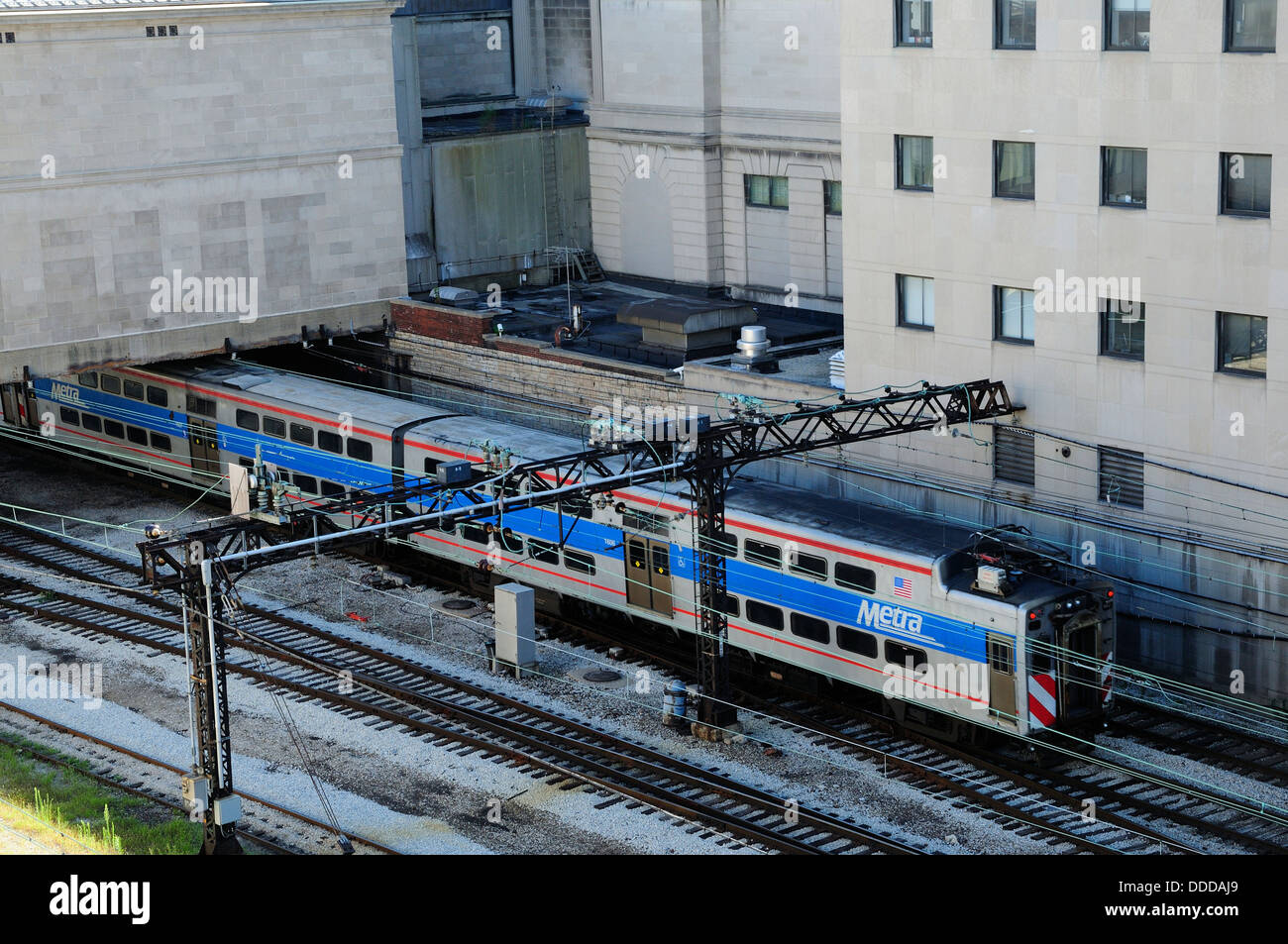 Electric Metra train running behind the Art Institute of Chicago Stock