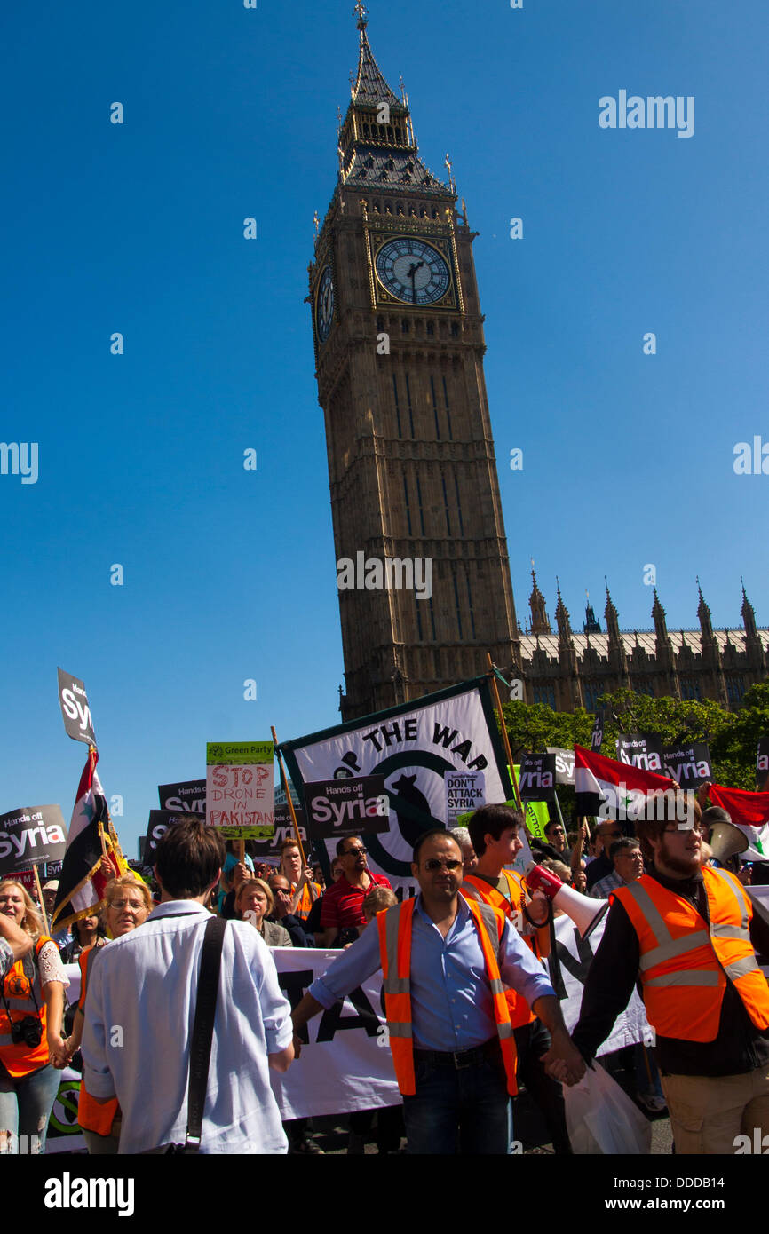 London, UK. 31st Aug, 2013.  Protesters pass Parliament as thousands march against US and other western countries using military intervention in the Syrian conflict following 'red line' chemical attacks on civilians. Credit:  Paul Davey/Alamy Live News Stock Photo