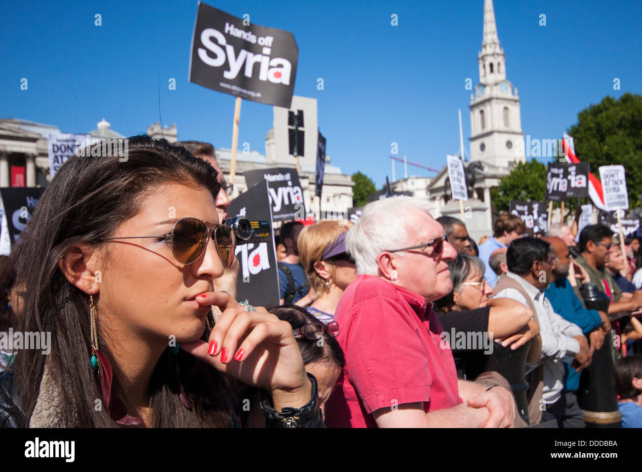 London, UK. 31st Aug, 2013.  Shadia Edwards Dashti, student representative of Stop The War Coalition listens to speeches at the rally in Trafalgar Square after marching against US and other western countries using military intervention in the Syrian conflict following 'red line' chemical attacks on civilians. Credit:  Paul Davey/Alamy Live News Stock Photo