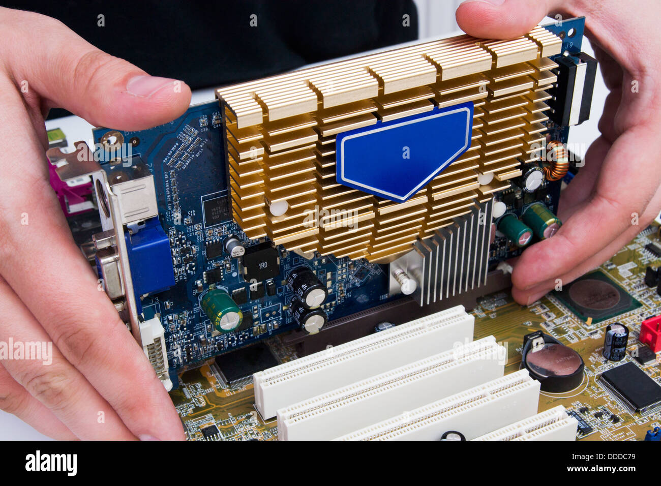 Man install GPU hardware. PC motherboard upgrade Stock Photo - Alamy