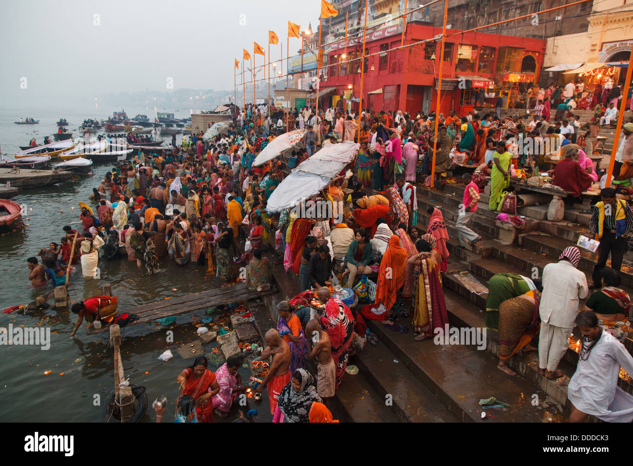 Indian Hindu pilgrims and devotees bathe in Ganges in the morning of one of Diwali festival days in Varanasi, India. 2012 Stock Photo