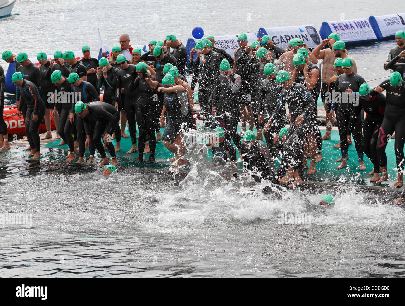 Copenhagen, Denmark. 31st Aug, 2013. 2,400 swim round the Parliament building, the Christiansborg Castle or Palace in central Copenhagen in the 2,000 m largest annual open water competition in Denmark, the Copenhagen Swim, organised by the Danish Swimming Federation and the newspaper Politiken. This is right before the start of the first heat, delayed about two hours by the environmental control due to a sewage overflow caused by a downpour the night before. Start and finish jetty. Credit:  Niels Quist/Alamy Live News Stock Photo