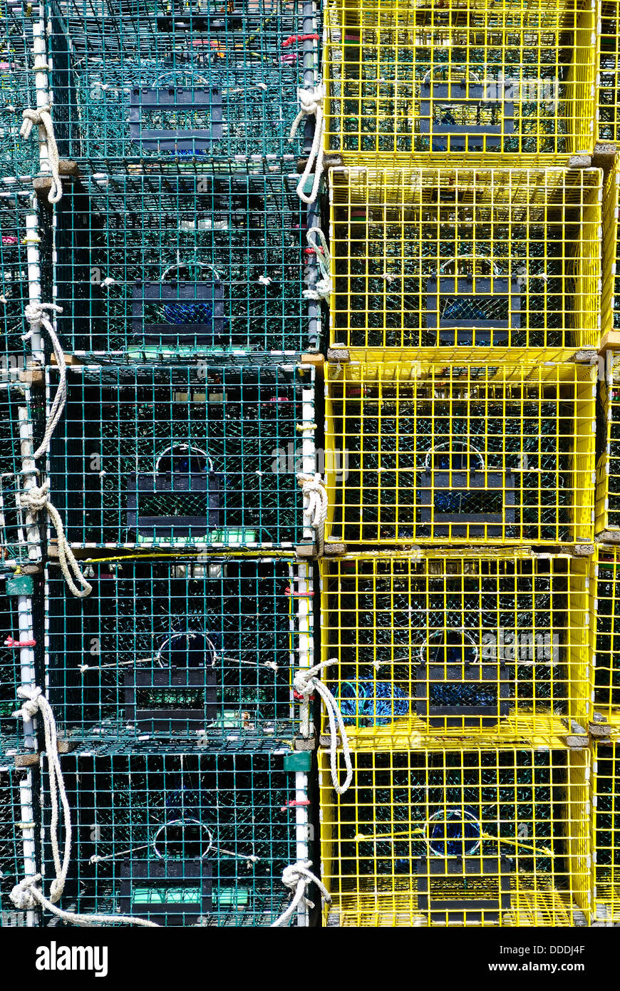 Green and Yellow Stacked Lobster Traps in Portland, Maine Stock Photo