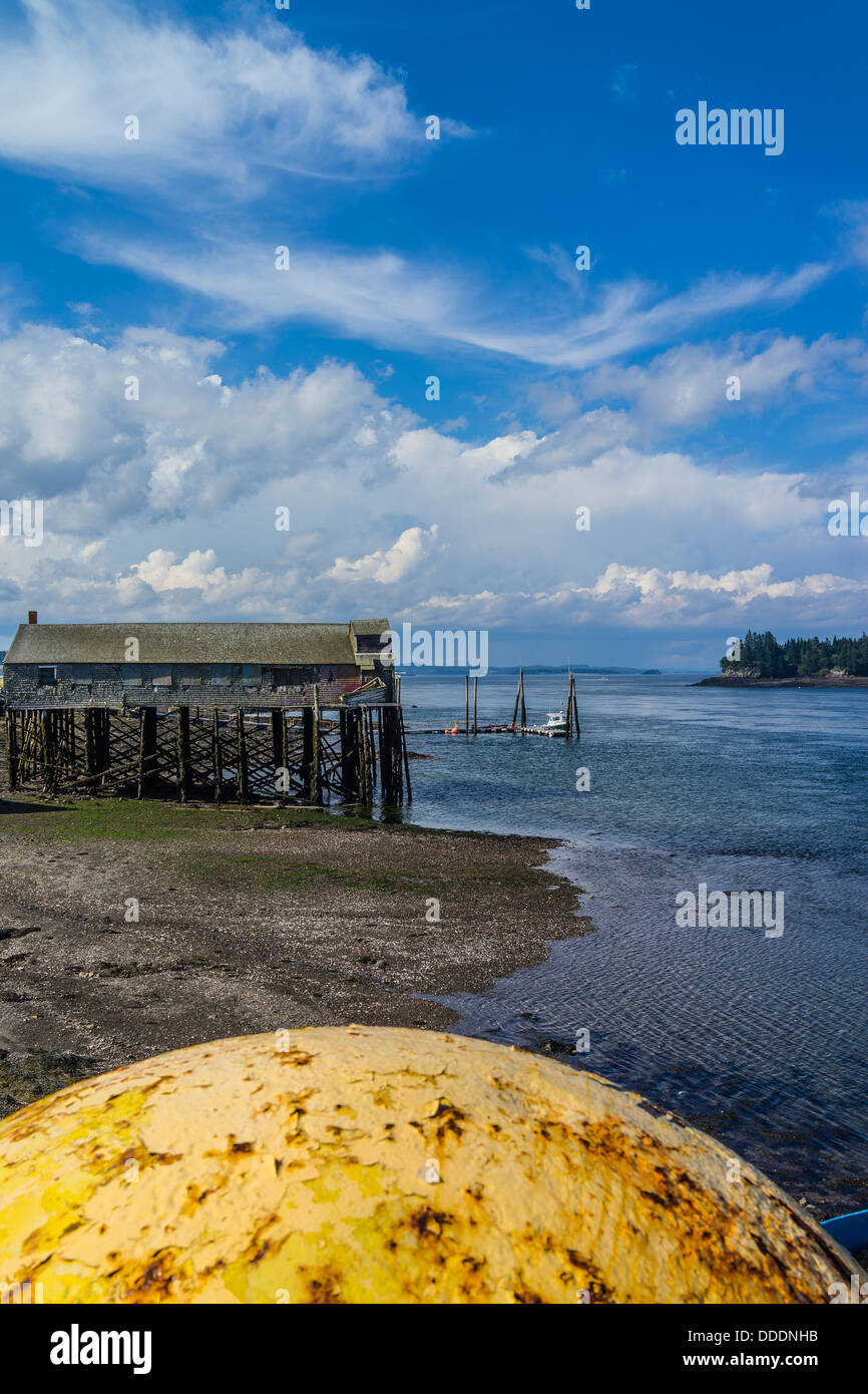 https://c8.alamy.com/comp/DDDNHB/a-view-of-the-lubec-maine-seashore-with-a-large-yellow-metal-float-DDDNHB.jpg