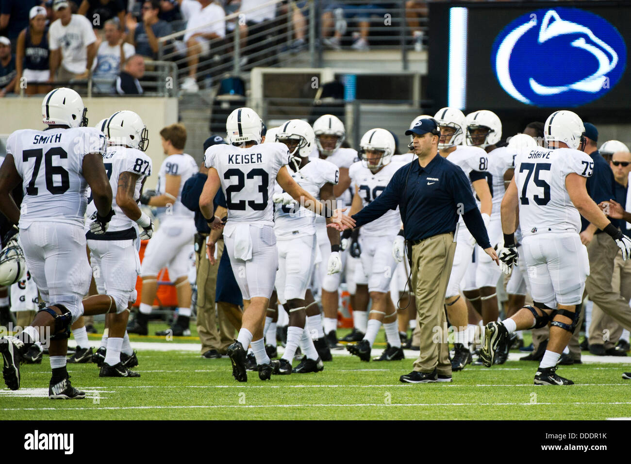 Aug. 31, 2013 - East Rutherford, NJ, U.S - August 31, 2013: Penn State Nittany Lions head coach Bill O' Brien congratulates Penn State Nittany Lions safety Ryan Keiser (23) and his team during the game between Penn State Nittany Lions and Syracuse Orange at Met Life Stadium in East Rutherford, NJ. Penn State Nittany Lions defeat The Syracuse Orange 23-17. Stock Photo