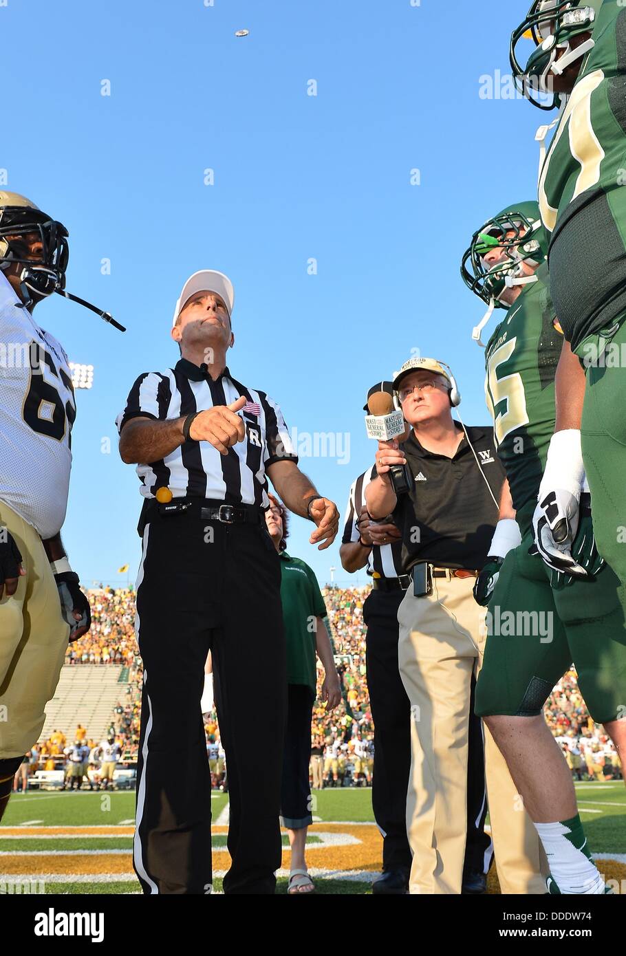 Aug. 31, 2013 - Waco, TX, United States of America - August 31 2013:..BIG 12 official performs coin toss before NCAA football game kick off at Floyd Casey Stadium in Waco, TX. Baylor leads 38-0 at the end of halftime. Stock Photo
