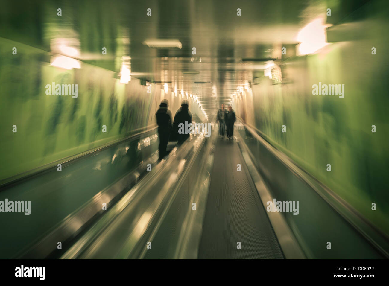 People on moving walkway to underground car park in Sydney, Australia. Stock Photo