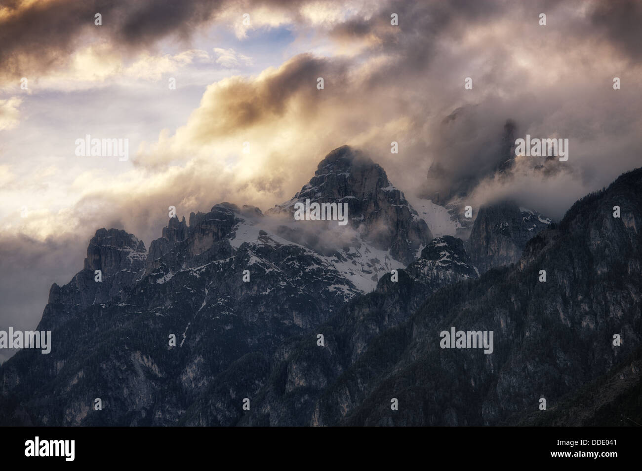 Cloudy sunset over Dolomites mountains. Italian Dolomites Stock Photo ...