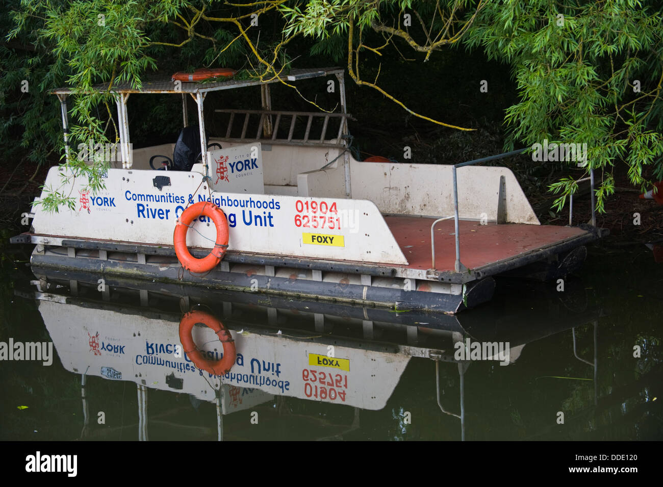 River cleaning boat on River Foss in the city of York North Yorkshire