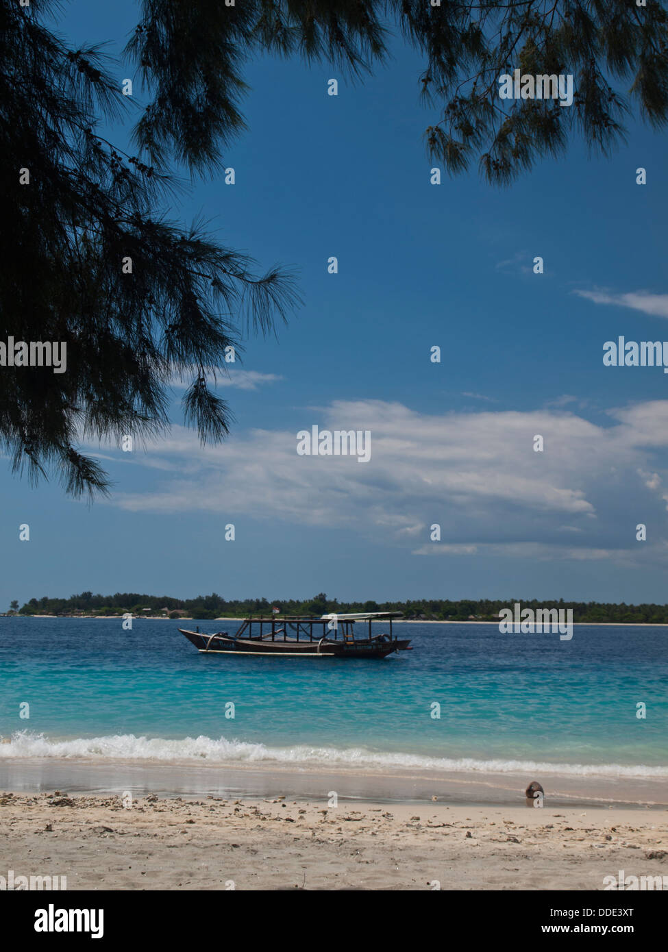 View of Gili Trawangan tropical sea beach with Gili Meno in background Stock Photo