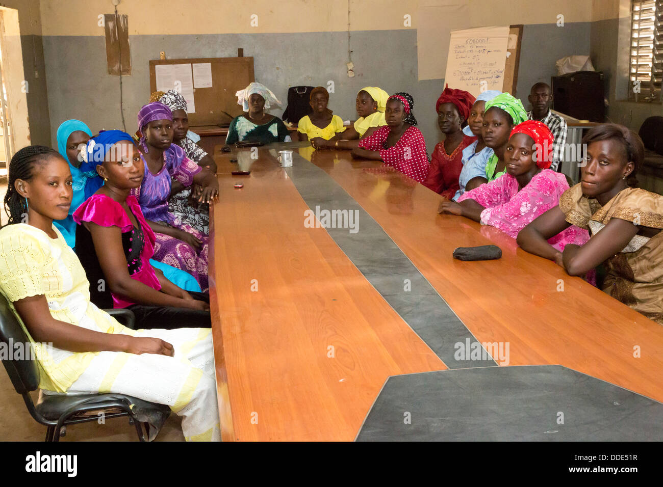 Microfinance. Women Receiving Instruction in how to estimate costs of planting and fertilizing a crop. Kaymor, Senegal Stock Photo