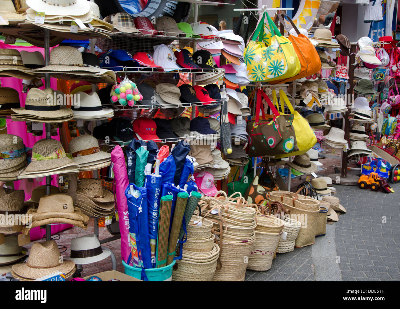 Hats and bags in a souvenir shops in the white village of Nerja
