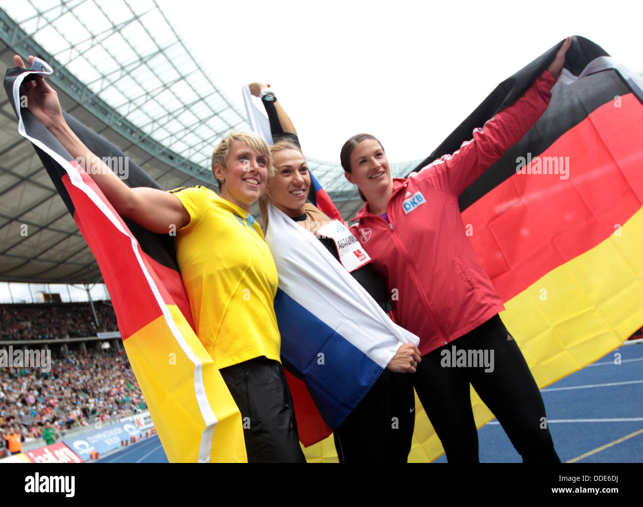 Third-placed Christina Obergfoell of Germany (L-R), winner Maria Abakumova of Russia and second-placed German Linda Stahl celebrate after the javelin throw competition of the international athletics meet ISTAF at Olympiastadion in Berlin, Germany, 01 September 2013.  Photo: MICHAEL KAPPELER Stock Photo