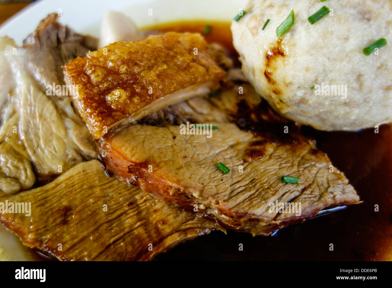 Bavarian roast pork with crackling and dumplings Stock Photo
