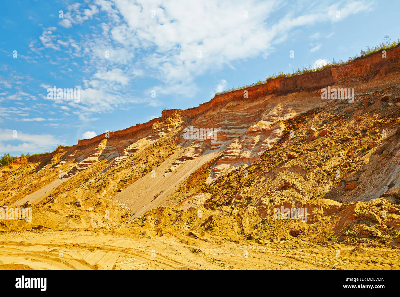 Landscape with the sandy road and cliff in summer sunny day Stock Photo