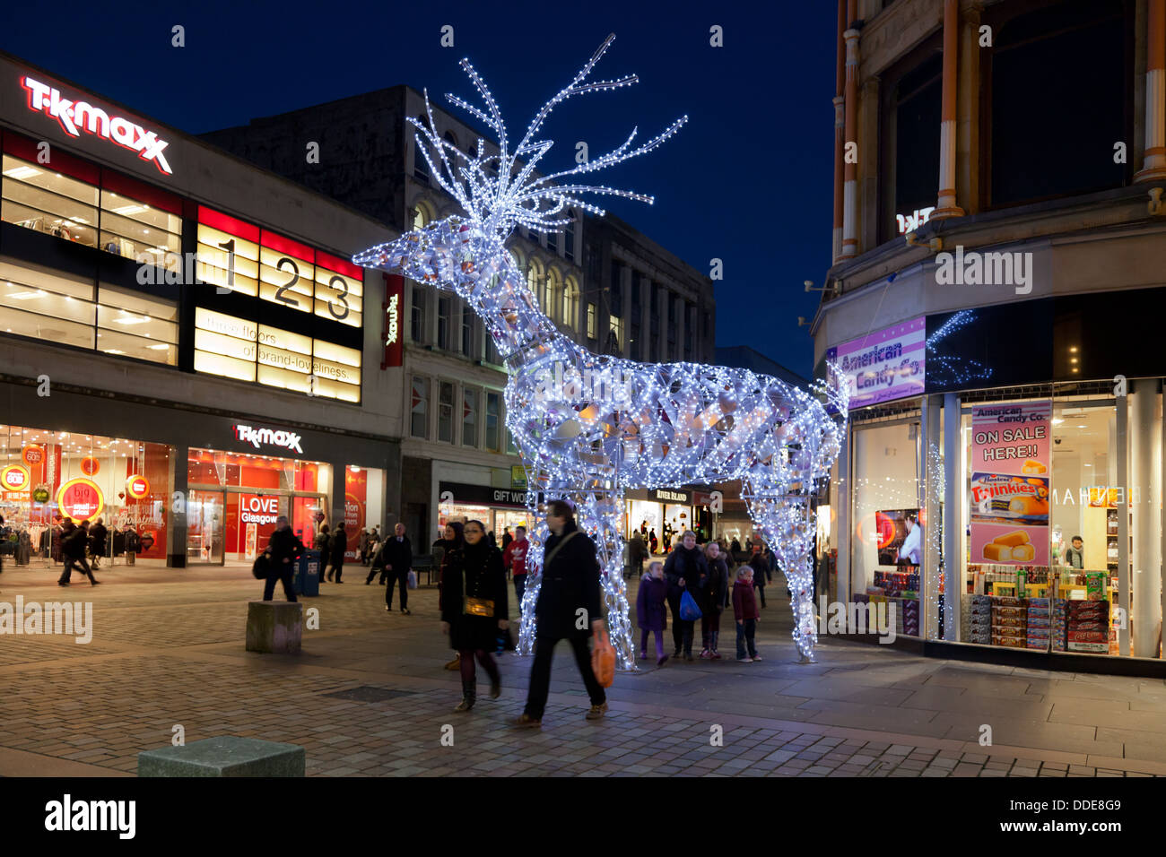 Illuminated Reindeer, part of the Christmas decorations in Argyle Street, Glasgow, Scotland, with passers by and shoppers. Stock Photo