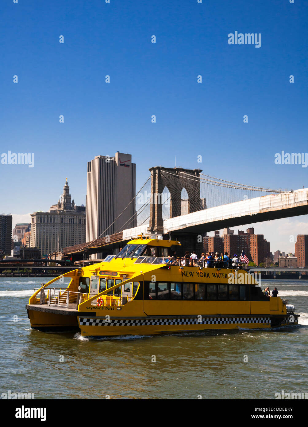 Yellow New York water taxi on the East River, NYC, USA. Stock Photo
